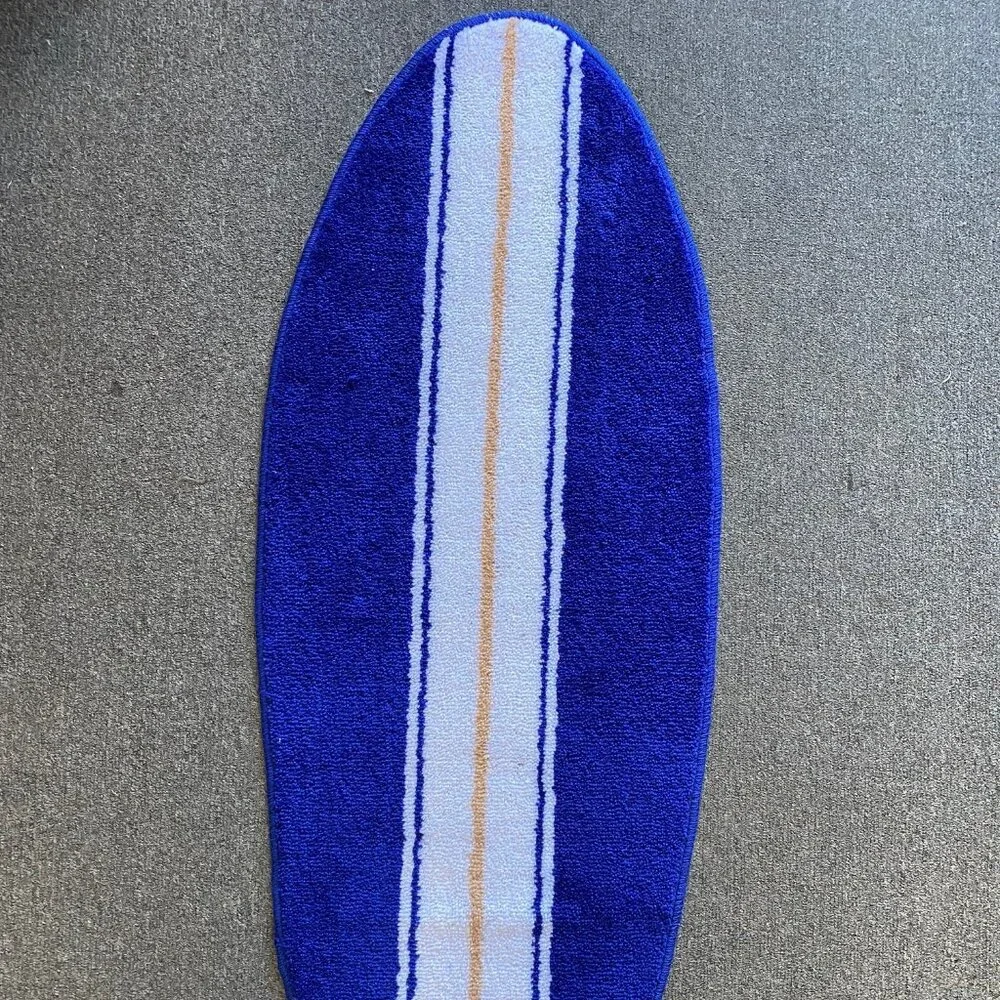 Blue and white surfboard shaped rug bath mat